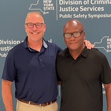 Moses Robinson with a colleague at the NYS Division of Criminal Justice Services Public Safety Symposium