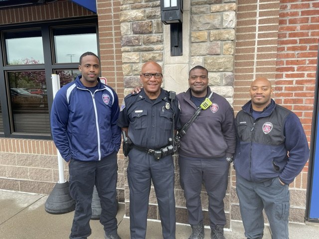 Moses Robinson in uniform with public safety colleagues